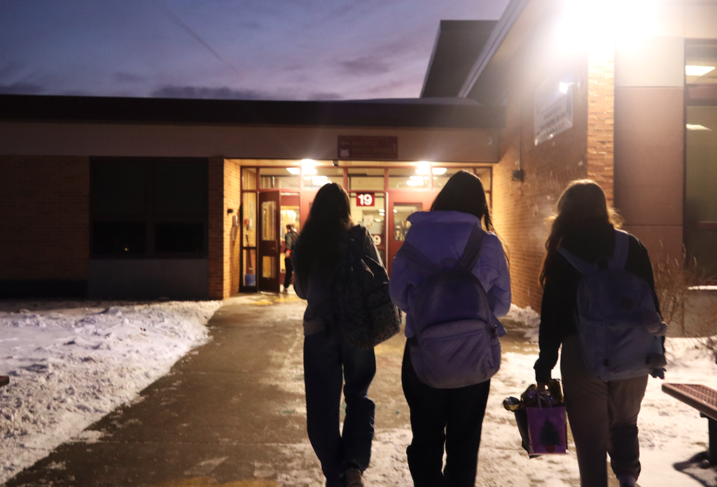 three girls walking into school