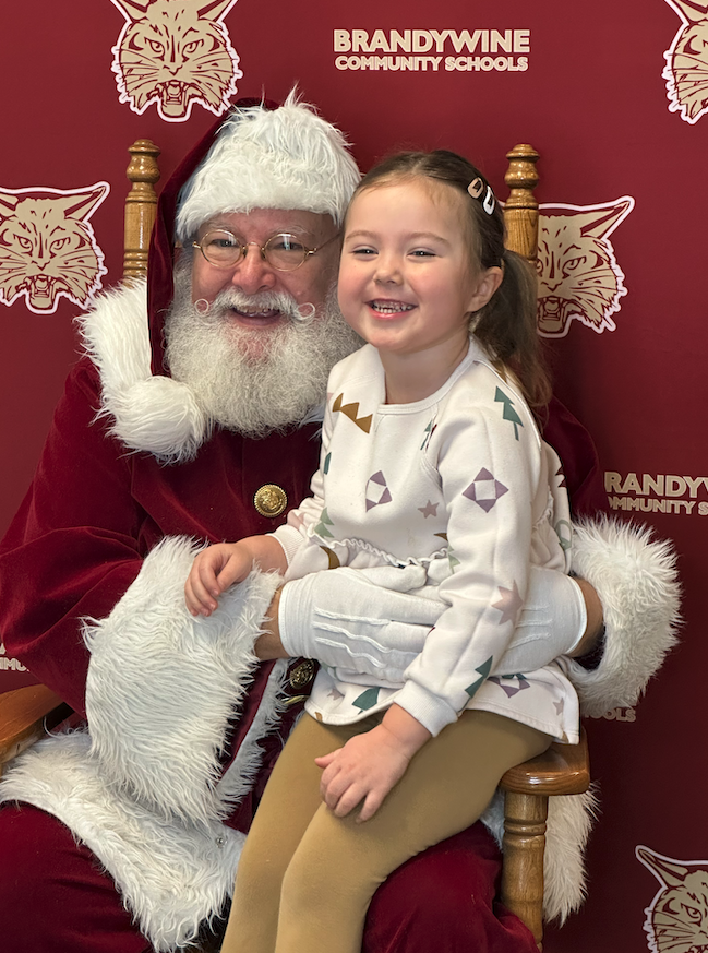 little girl sitting on Santa's lap