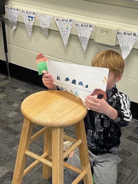 student doing a puppet show