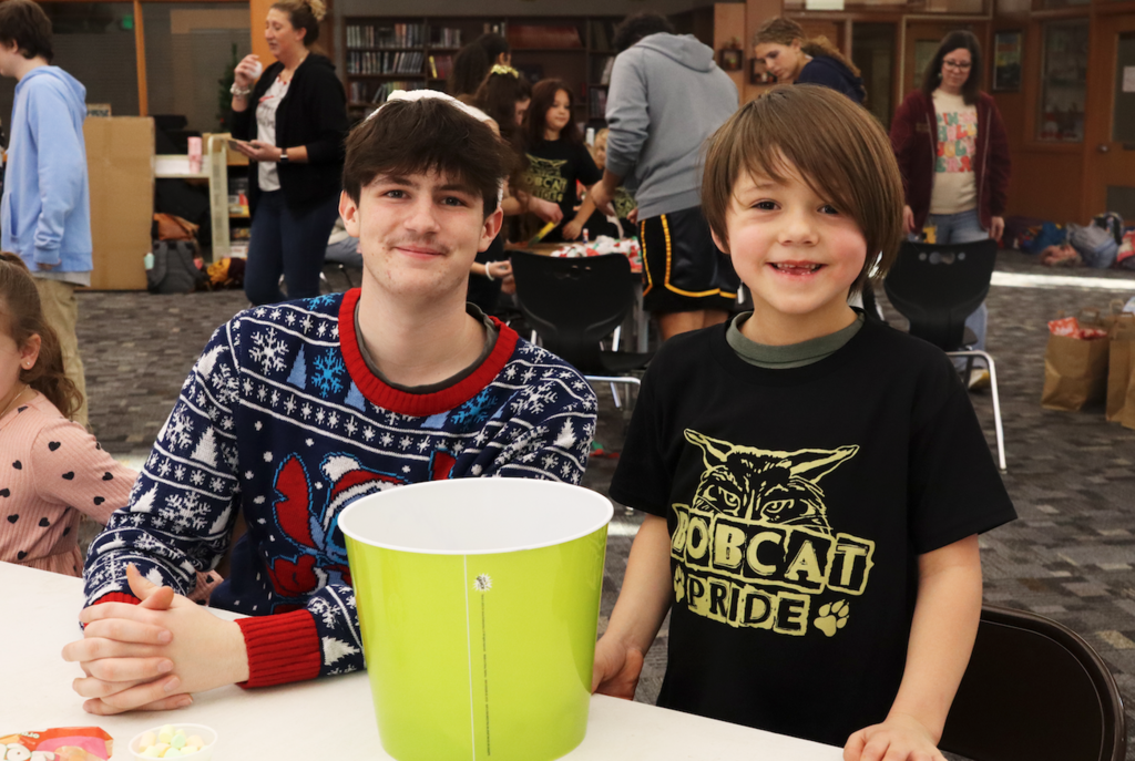 teenage boy with little buddy boy from Merritt