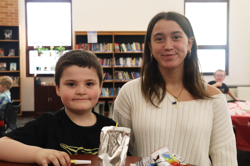 teenage girl with little buddy boy from Merritt
