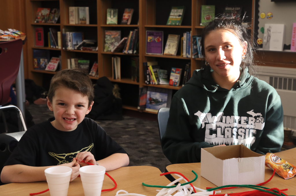 teenage girl with little buddy boy from Merritt