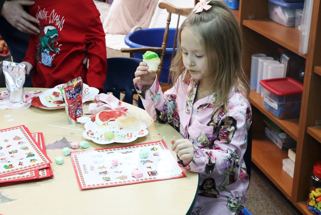 little girls eating cupcake