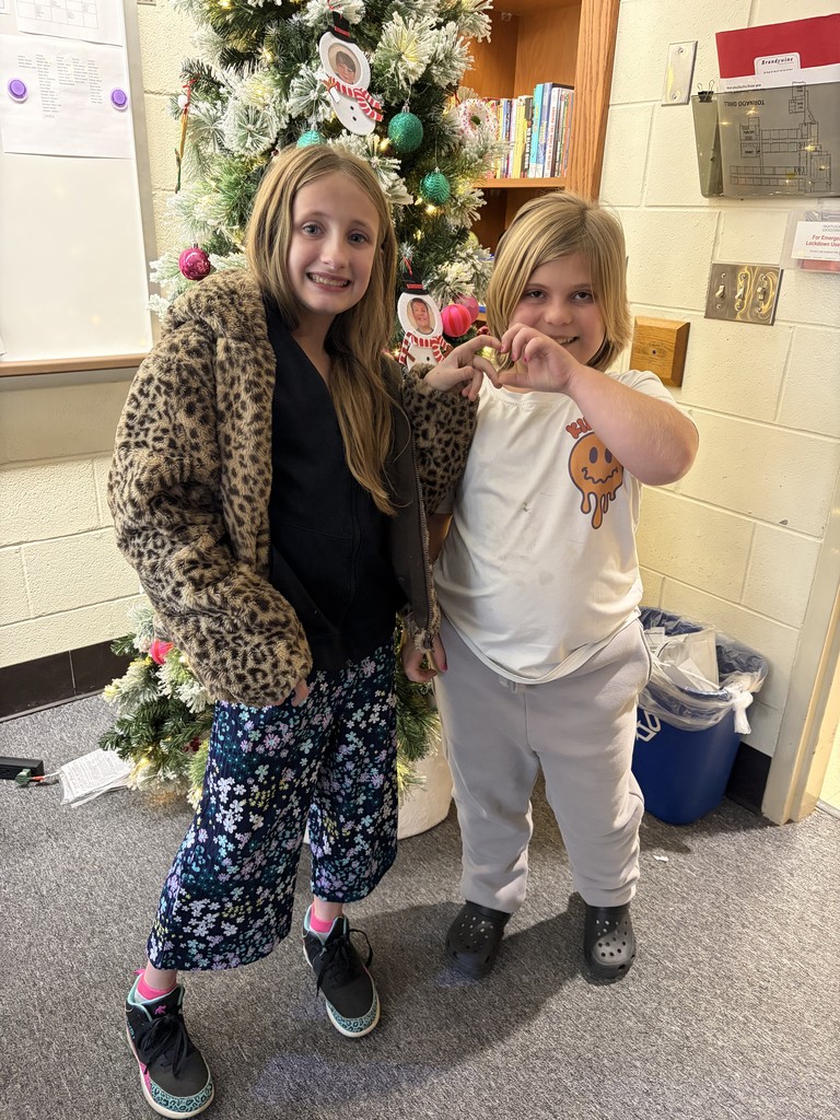 two little girl making a heart