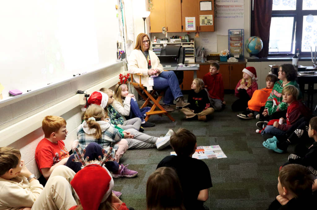students seated in a circle