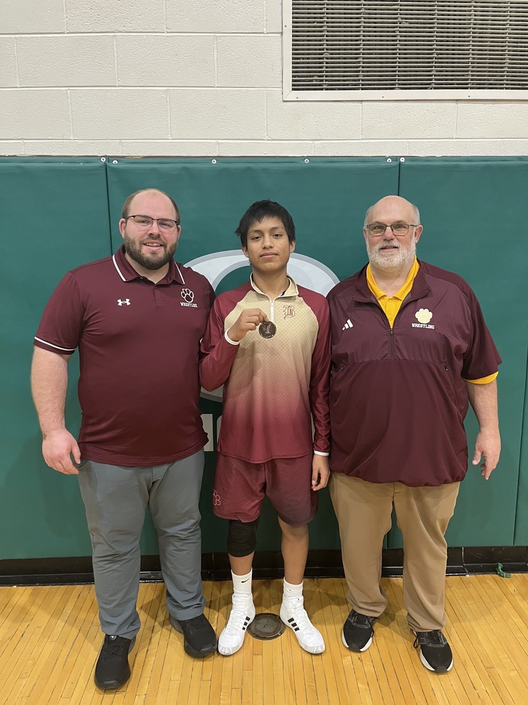 wrestler with 2 coaches