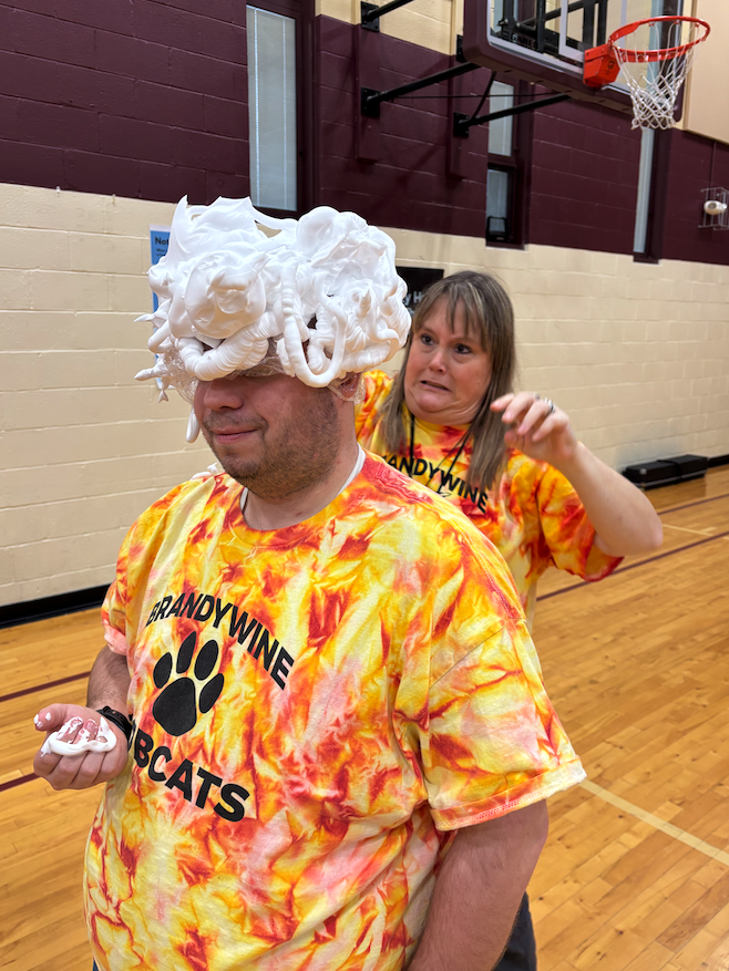 teacher putting shaving cream on their head