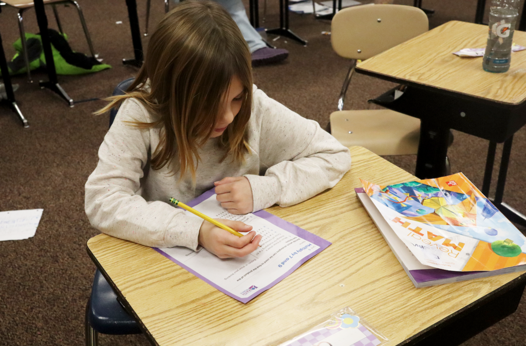 little girl doing math work