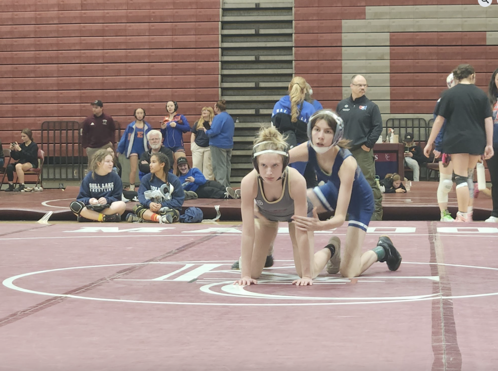 two women wrestlers getting ready to wrestle