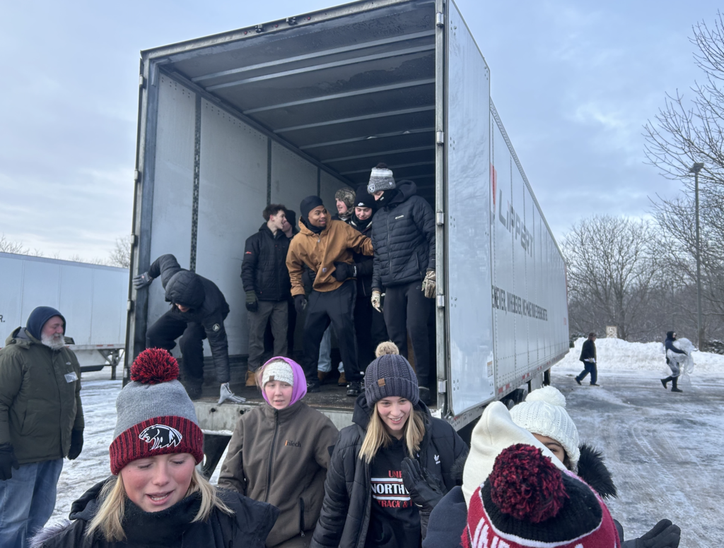 team unloading food from trucks
