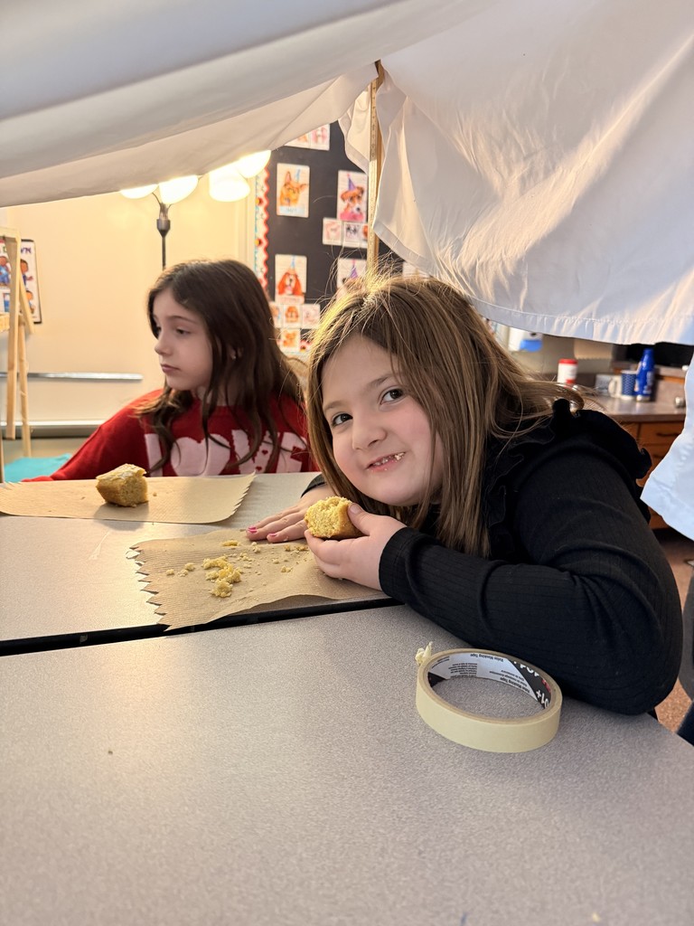 student eating cornbread