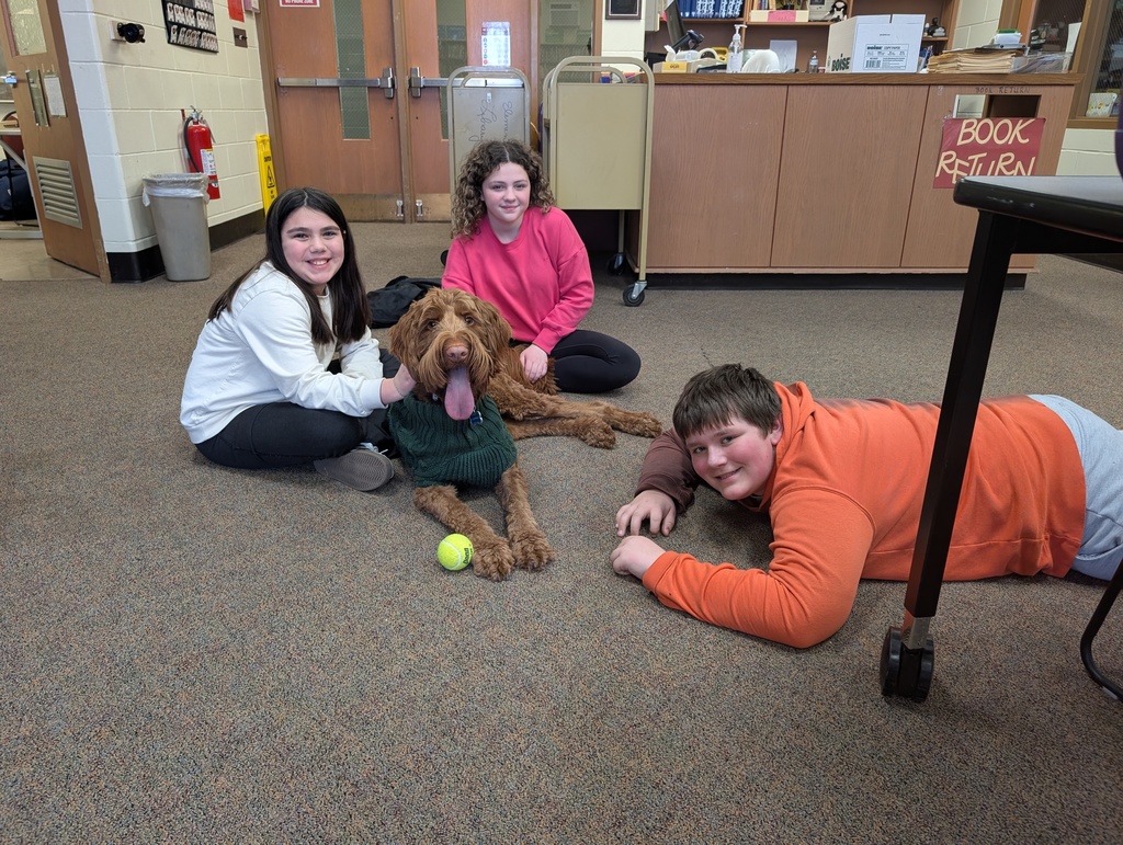 copper with two girls and boy with his ball