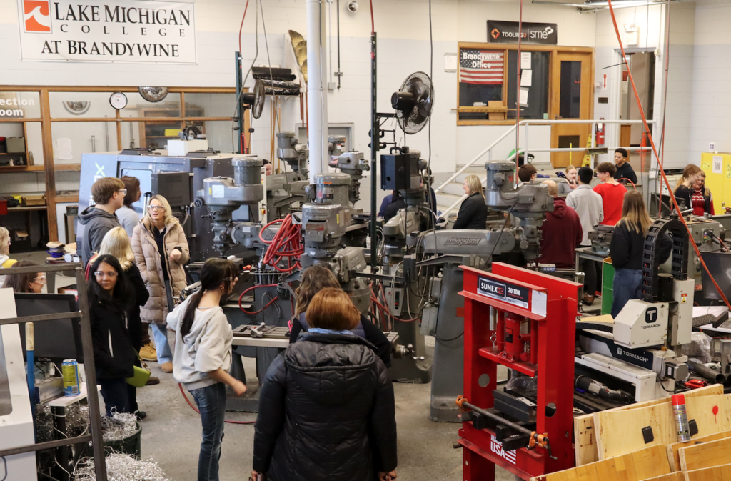 group gathered in machine shop