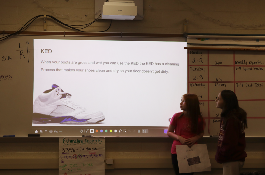 young girls presenting boot cleaner