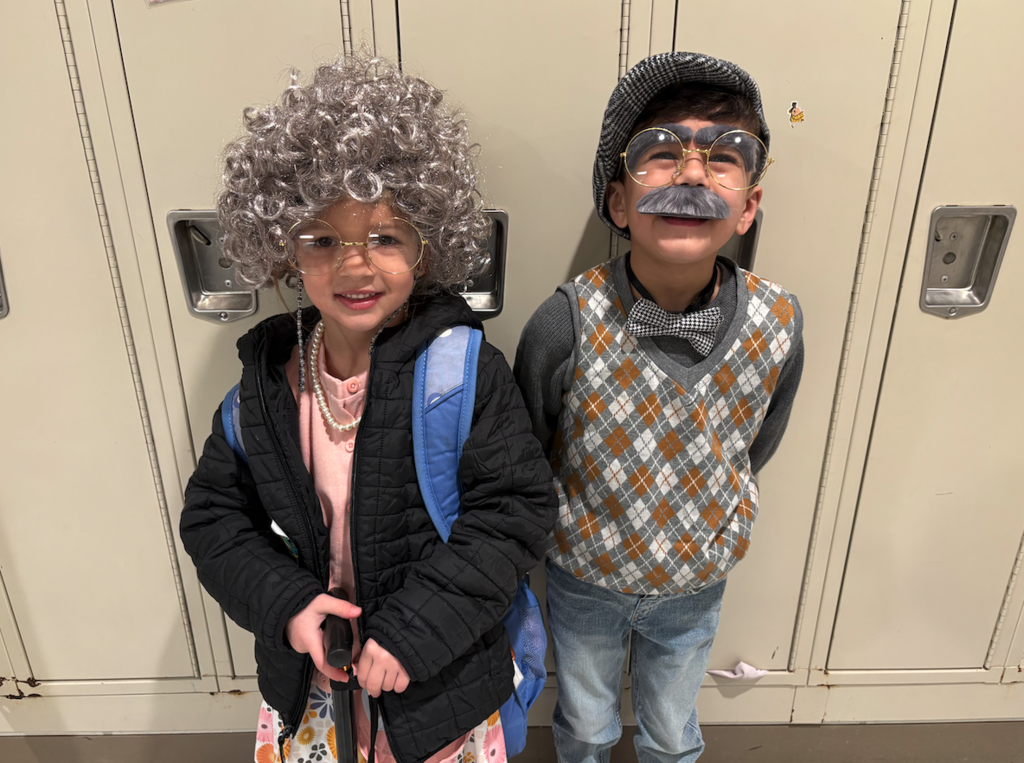a little girl and little boy dressed as old people