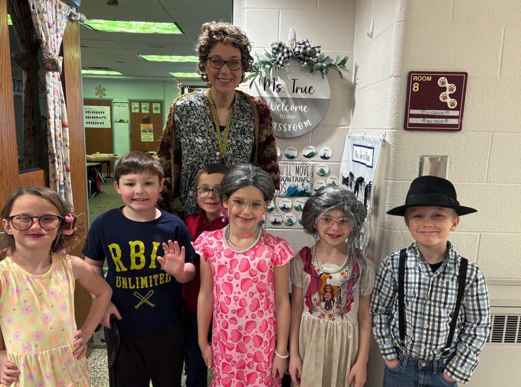 teacher with 6 kids dressed as old people