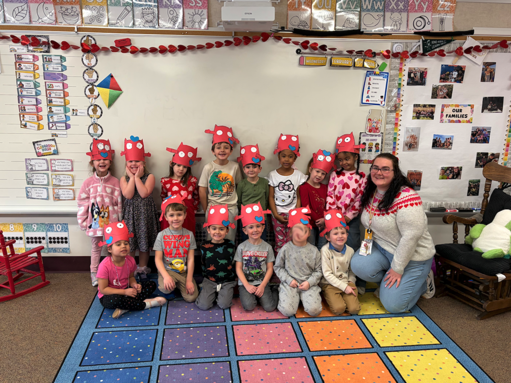 class of kids in valentine's crowns