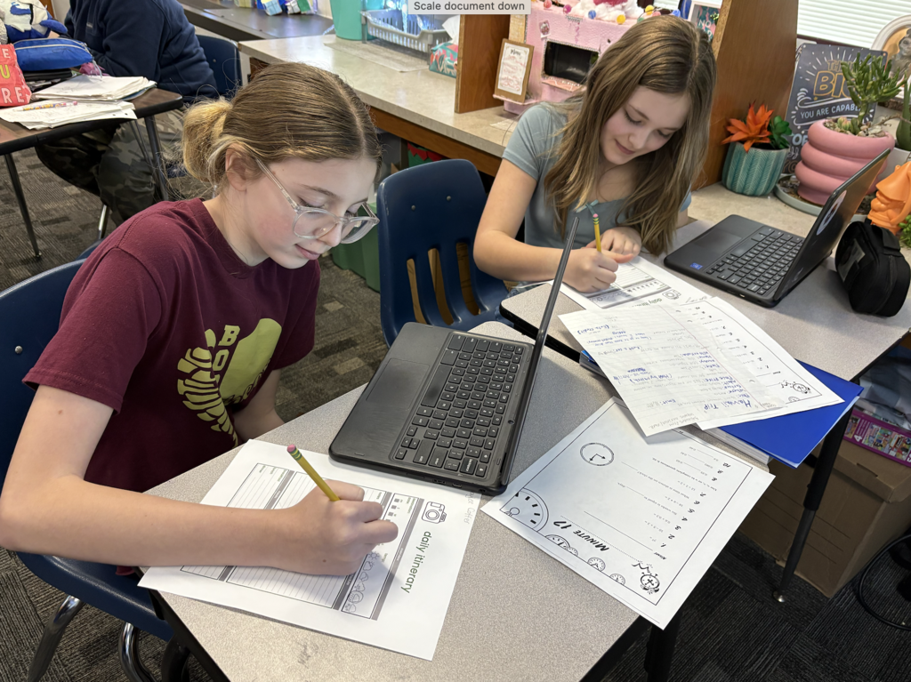 students writing on paper