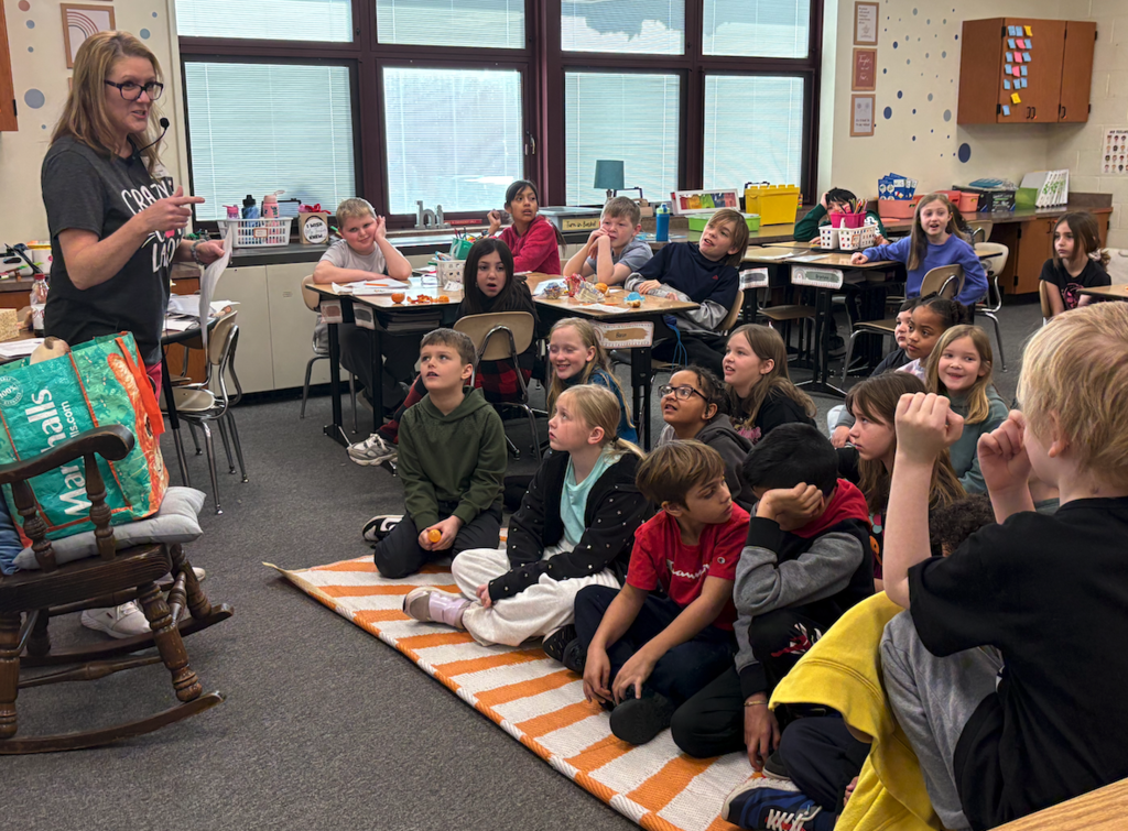 author at front of the class talking