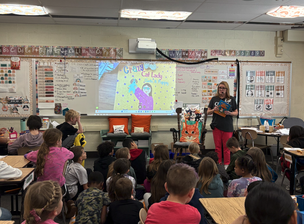 author at front of the class talking
