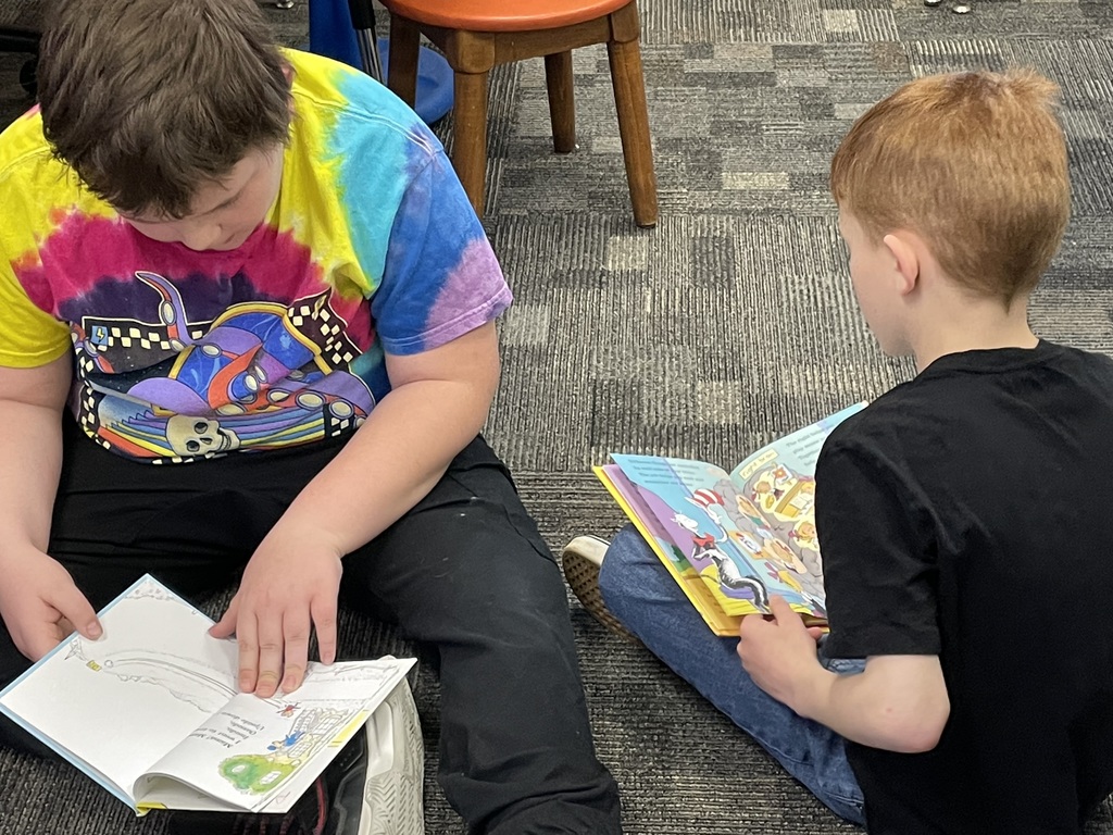 two boys reading books