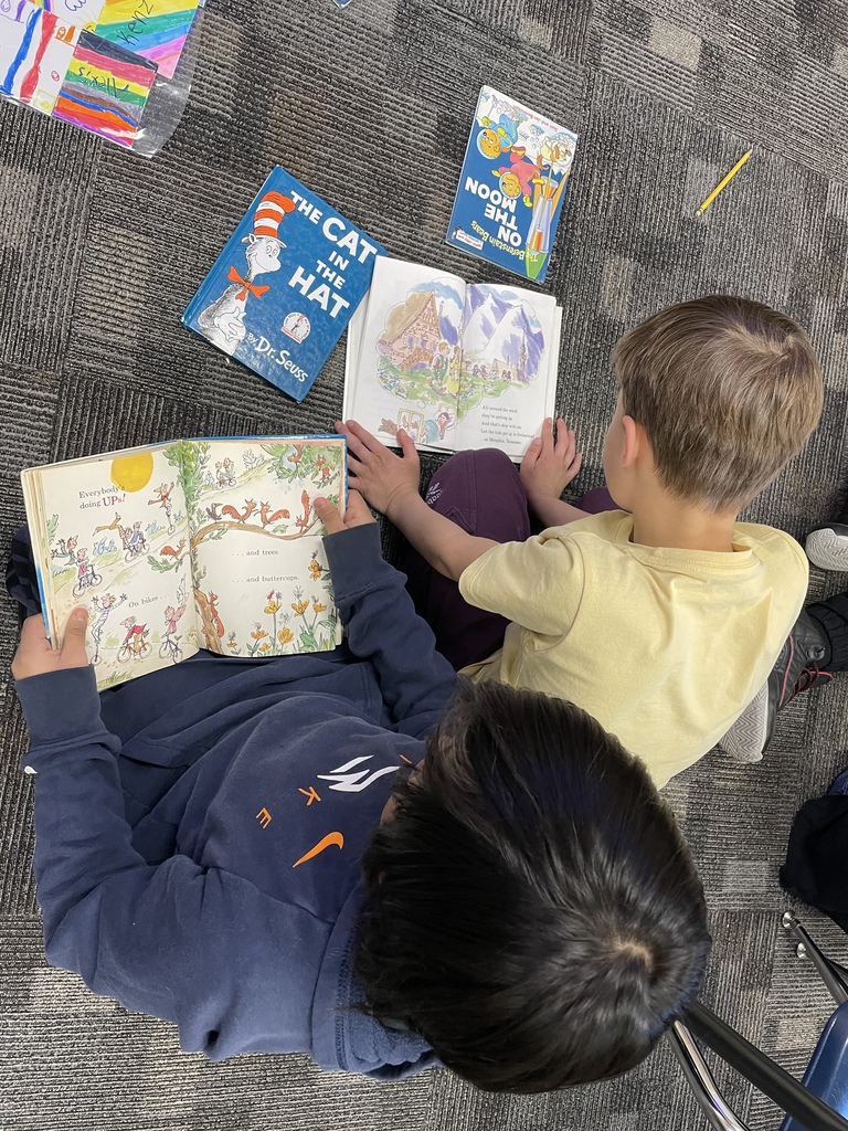 two kids reading dr suess books