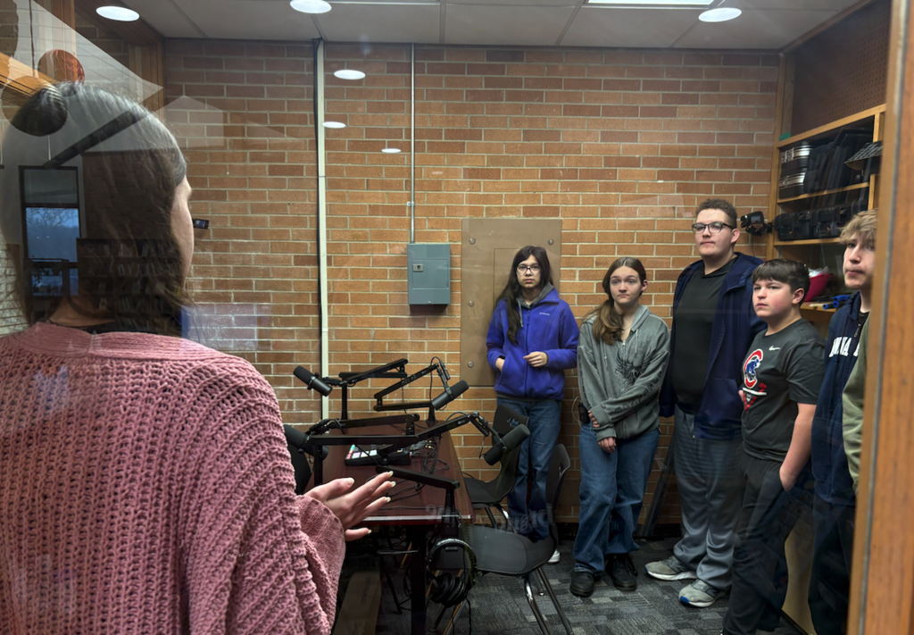 students in podcast room