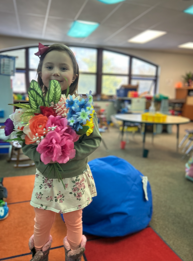 little girl with bouquet of flowers