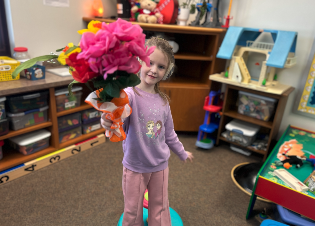 little girl with bouquet of flowers
