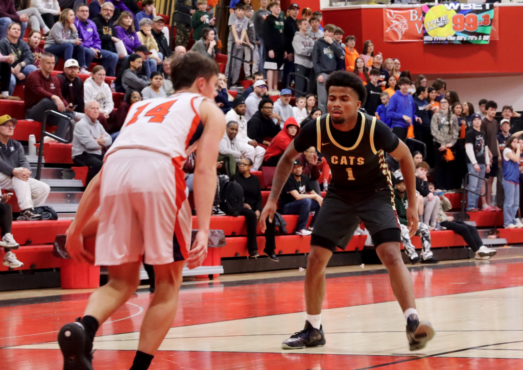 basketball player defending other team player