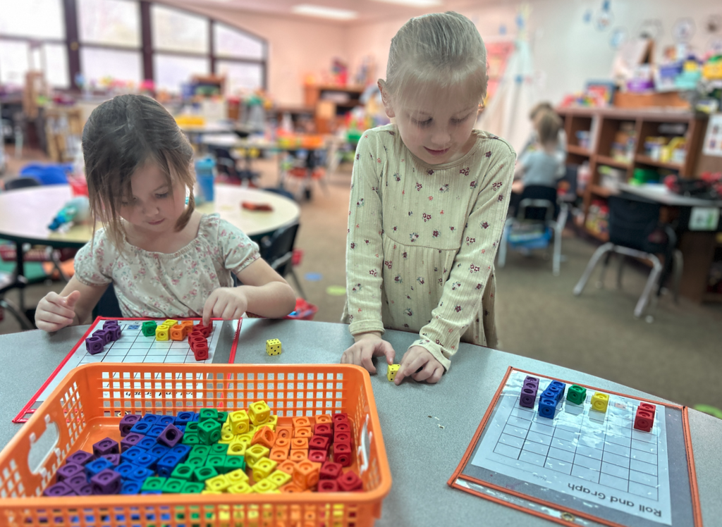 two little girls building graphs