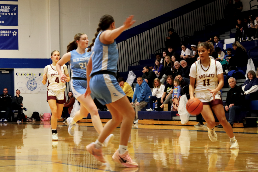 girl running with basketball 