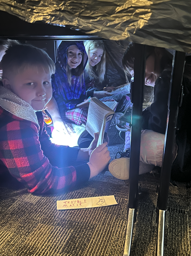 kids under desks reading