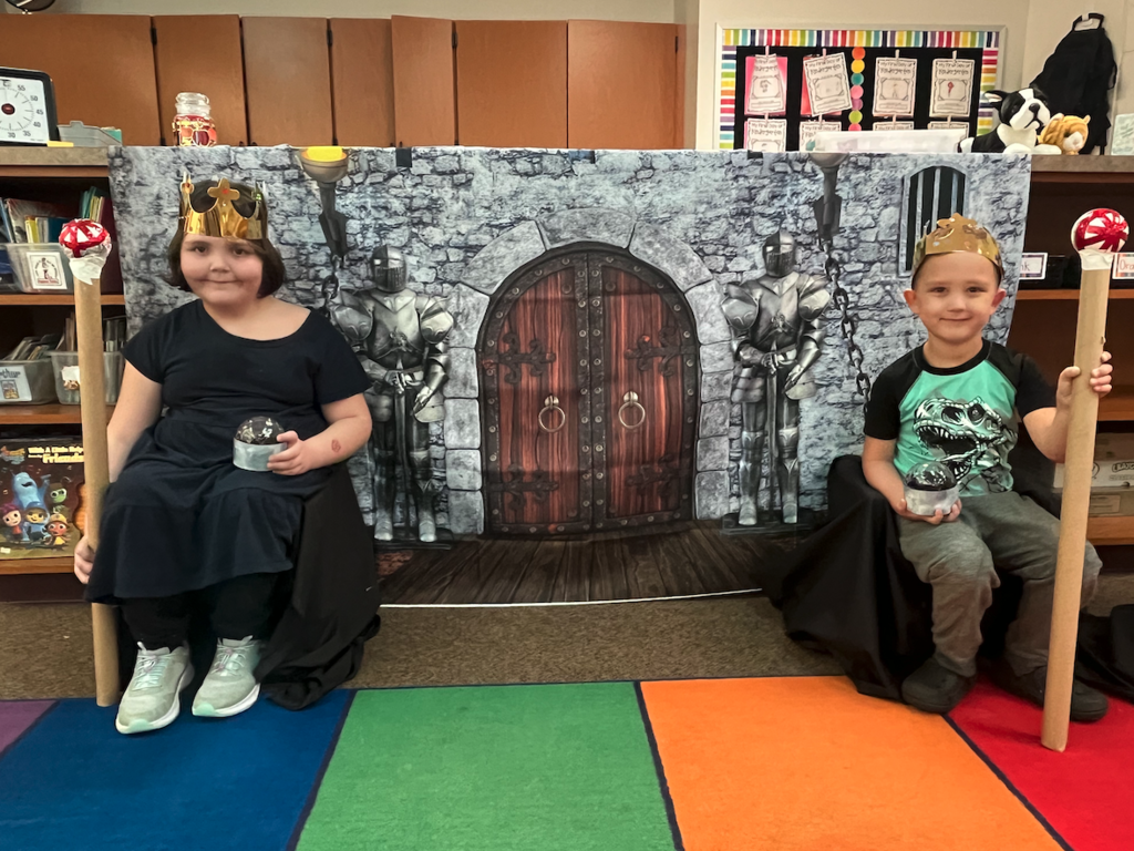two little kids dressed as royalty