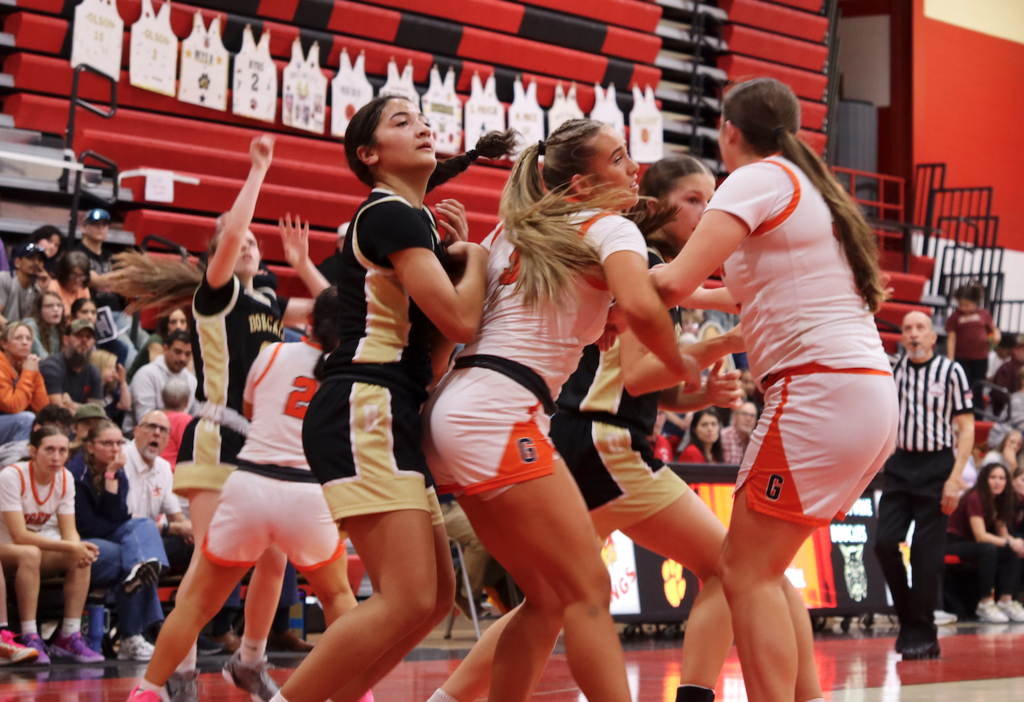 girls guarding each other on basketball court