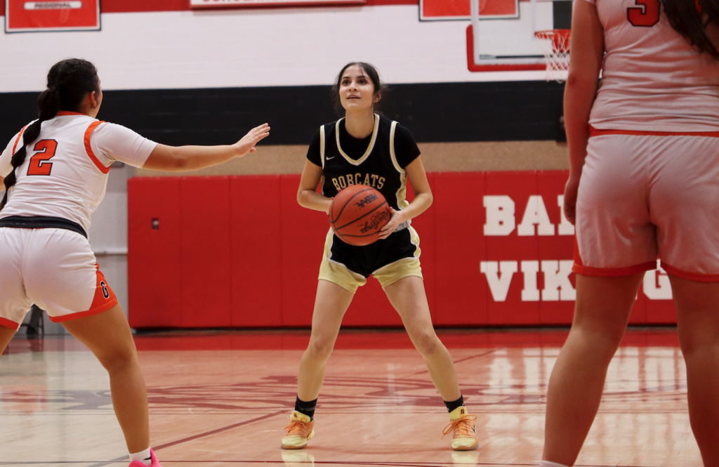 basketball player getting ready to shoot the basket