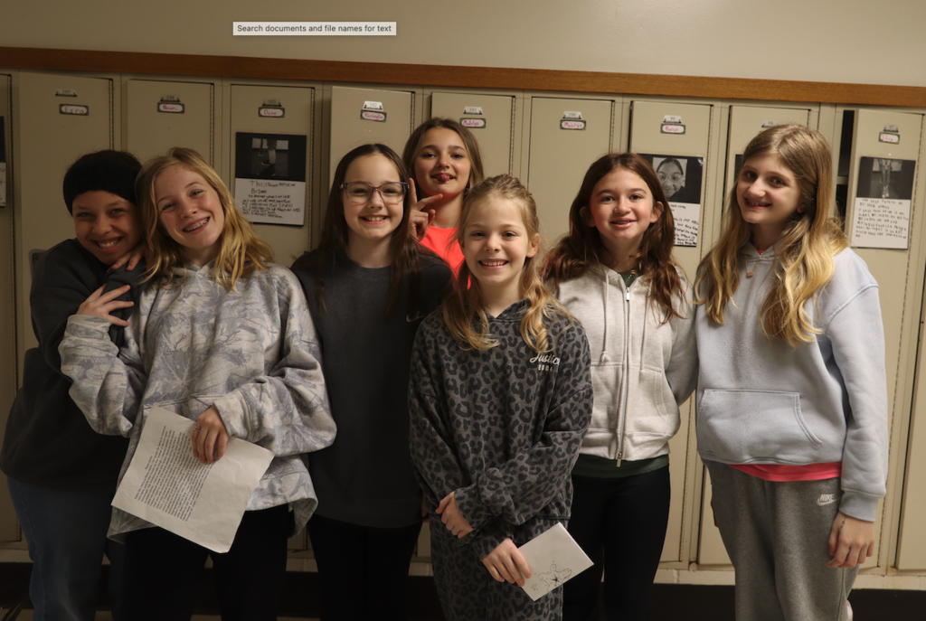 girls in hallway at school smiling