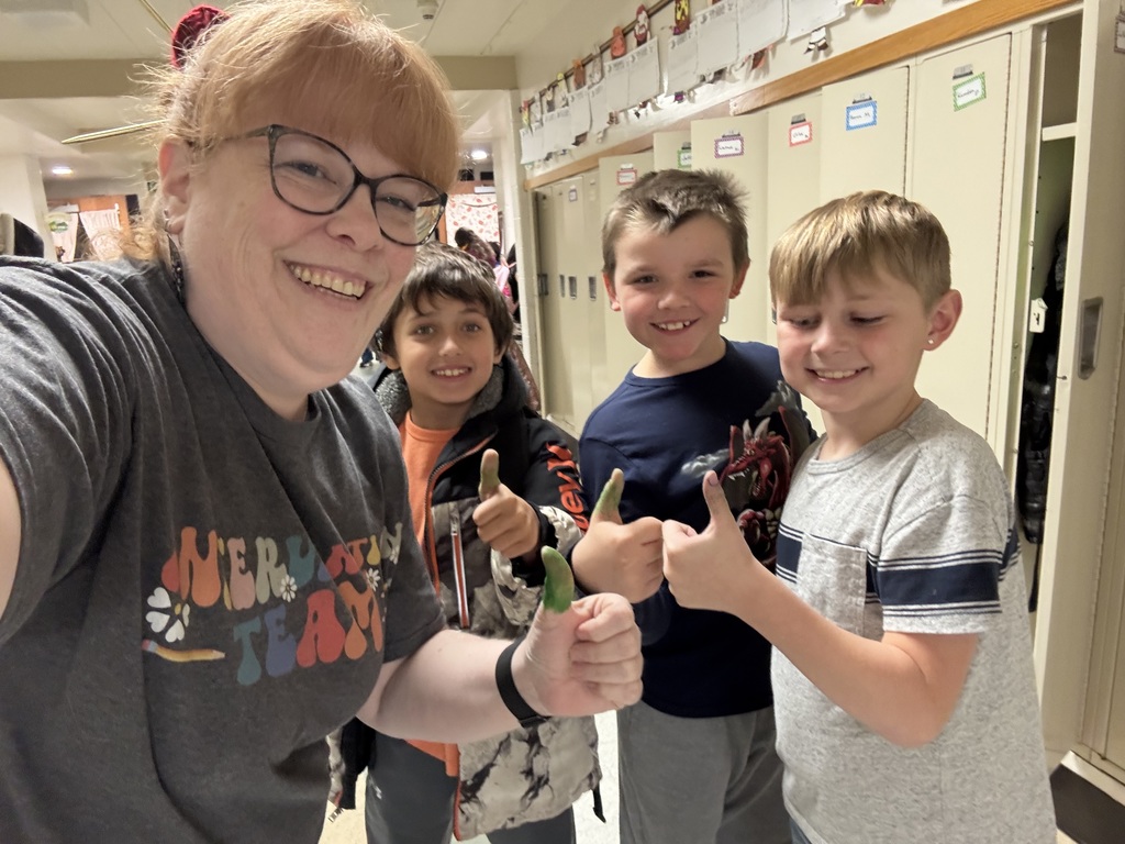 students with teacher and green thumbs