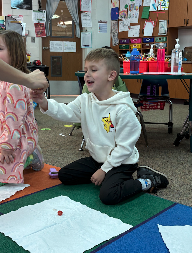 little boy taking fruit and veggie