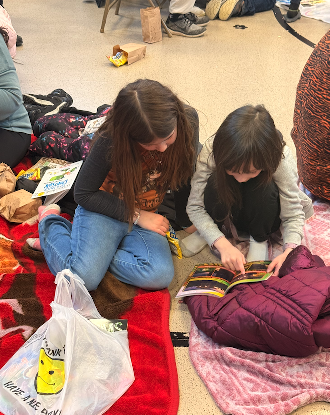 two little girls reading