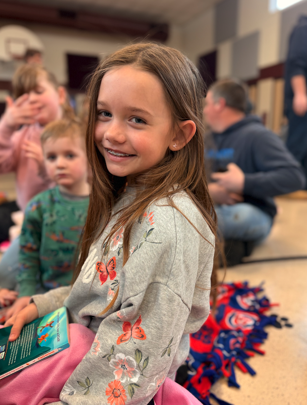 little girl smiling at camera