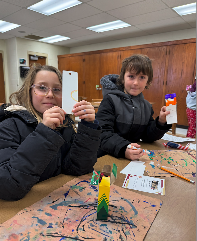 two kids making bookmarks