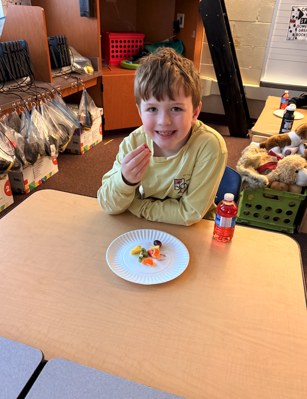 little boy eating fruits