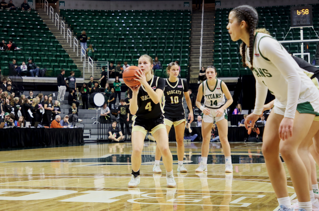 player taking shot at basketball hoop