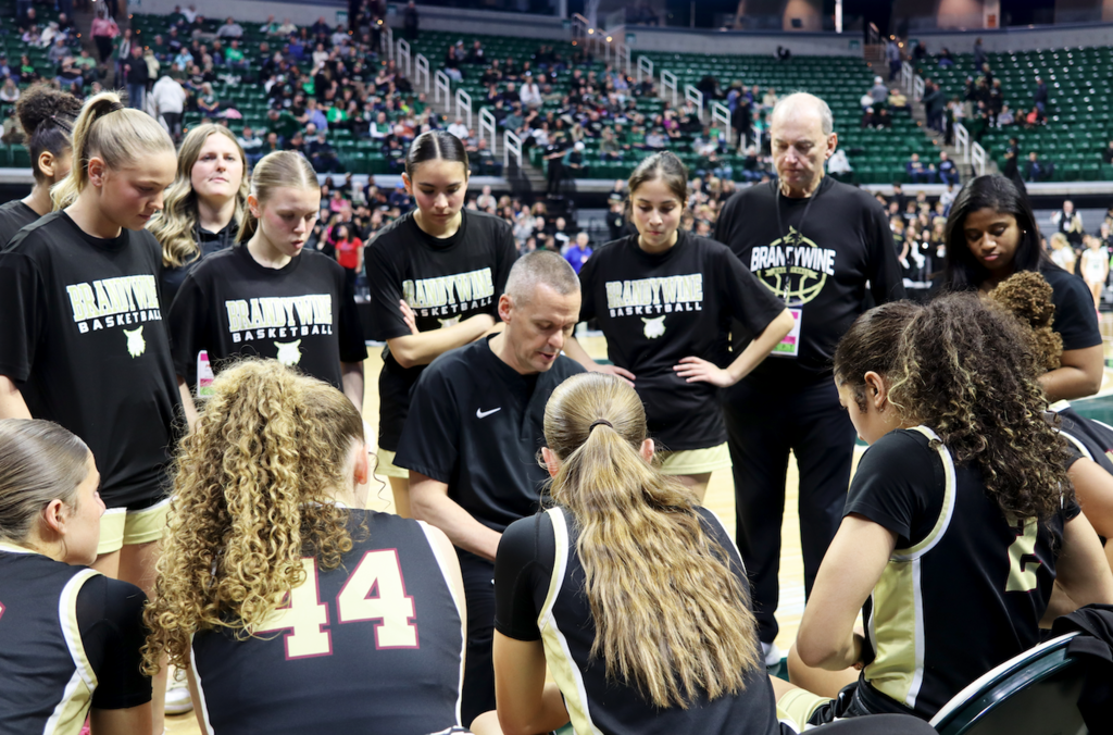 team gathered at bench