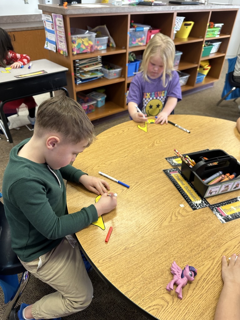 kids drawing at desk