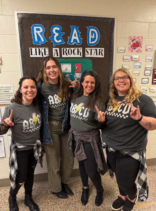 4 teachers dressed up as rockstars