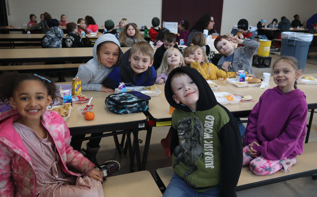 group of kids at lunch table