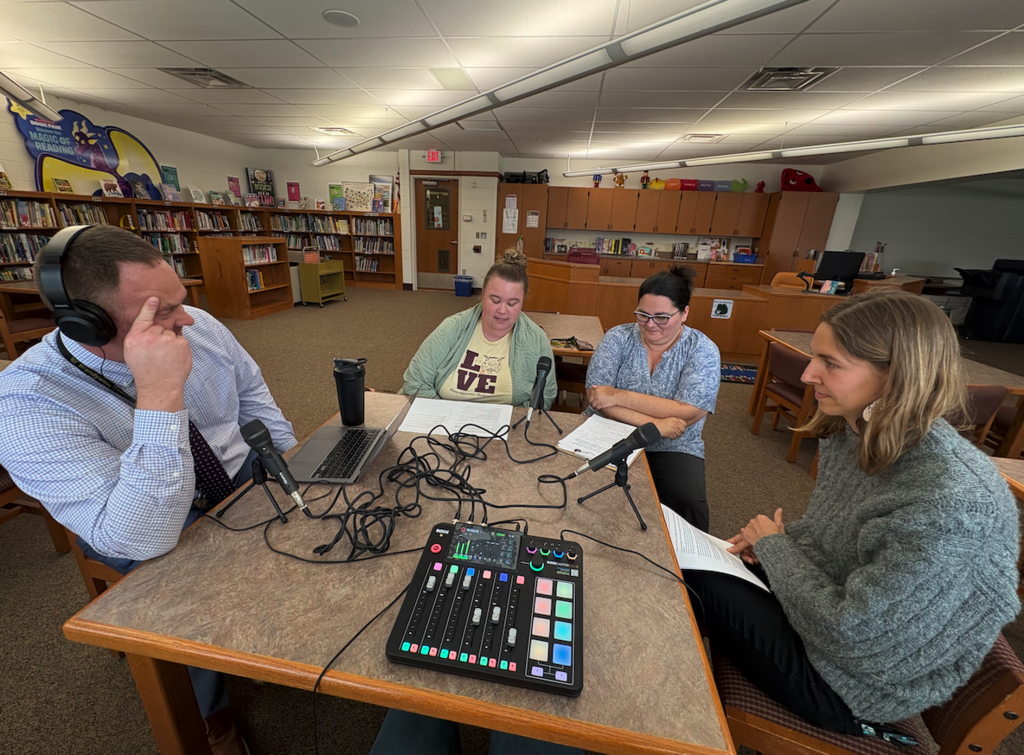 group of teachers and mr walker at podcast table