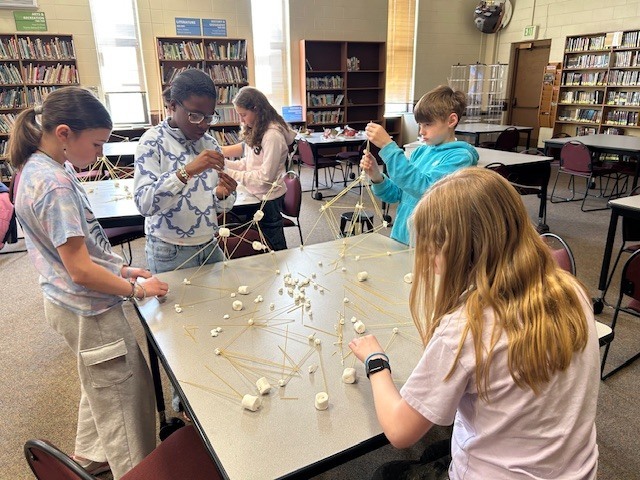 students working on marshmallow towers